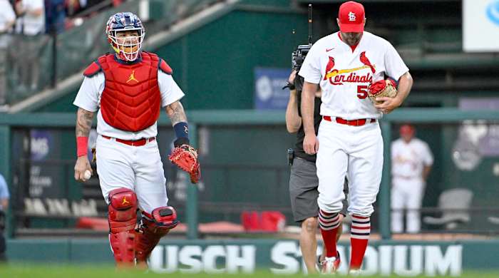 Sep 14, 2022; St. Louis, Missouri, USA;  St. Louis Cardinals catcher Yadier Molina (4) and starting pitcher Adam Wainwright (50) walk in from the bullpen before their 325th start as a battery breaking the MLB record before a game against the Milwaukee Brewers at Busch Stadium.